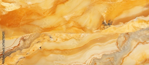 Close-up view showcasing a marble slab with striking yellow and brown tones, creating a visually appealing texture and pattern