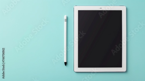 digital tablet and stylus pen on light blue background photo