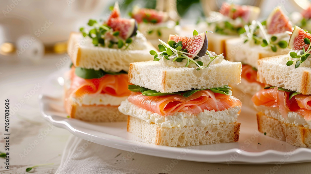 Delicate finger sandwiches filled with a variety of gourmet spreads such as smoked salmon and cream cheese or honey roasted ham and fig jam. Delicate finger sandwiches filled with a variety of gourmet spreads such as smoked salmon and cream cheese or honey roasted ham and fig jam.