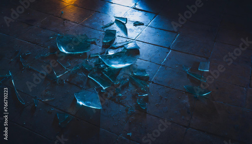 Shattered glass falling to the floor, scattered, clear, shards, sharp, brick,, tile, mystery, dark