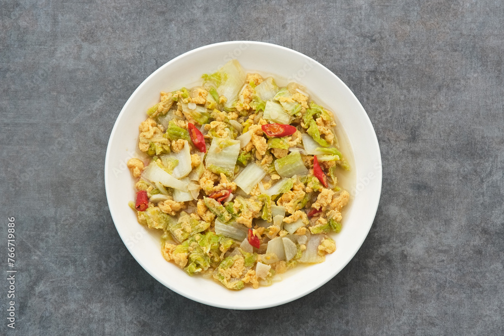 Tumis Sawi Telur or stir fry egg cabbage, Indonesian food
Tumis Sawi Telur or stir fry egg cabbage, Indonesian food