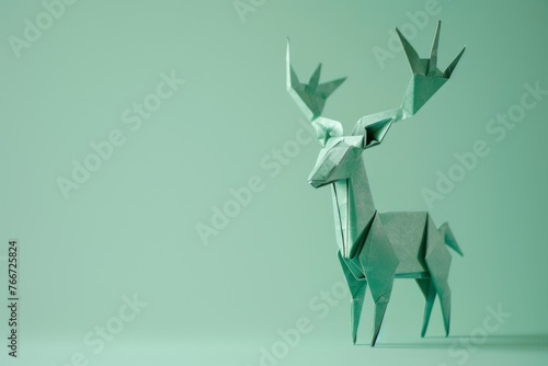 origami Deer on pastel green background photo