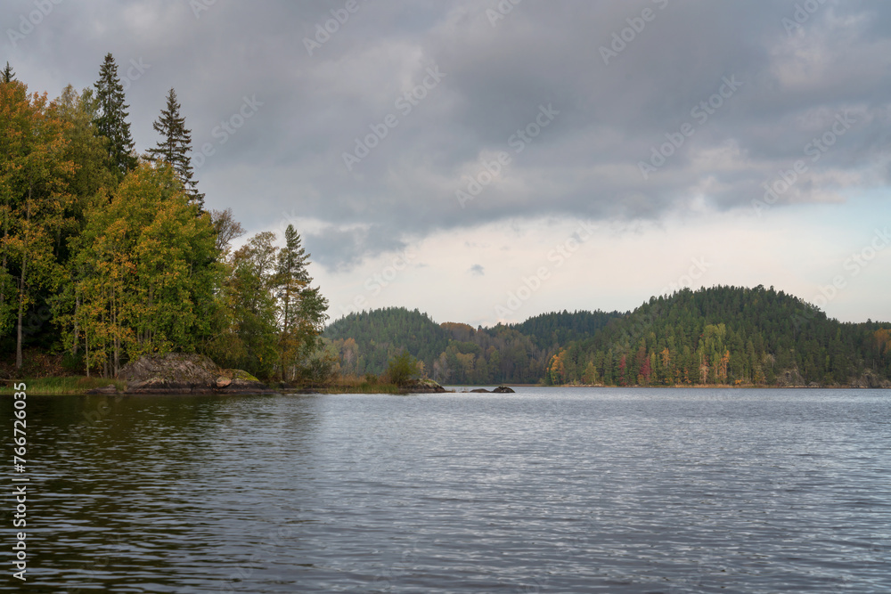 Fototapeta premium Lake Ladoga near the village Lumivaara on a sunny autumn day, Ladoga skerries, Lakhdenpokhya, Republic of Karelia, Russia