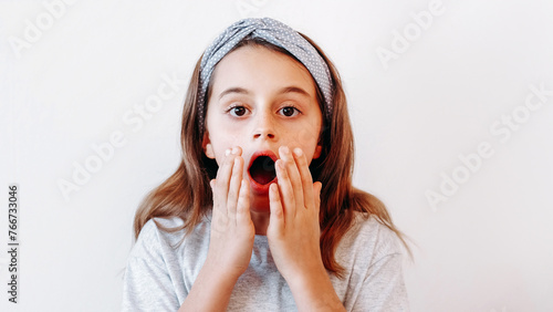 Shocked kid surprised child astonished little girl
