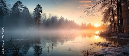 The image features a detailed view of a serene lake abundant with water and surrounded by lush trees, creating a soothing natural landscape. © TheWaterMeloonProjec