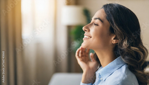side profile of blissful young woman in her 30s, reveling in relaxation, emitting tranquility and joy