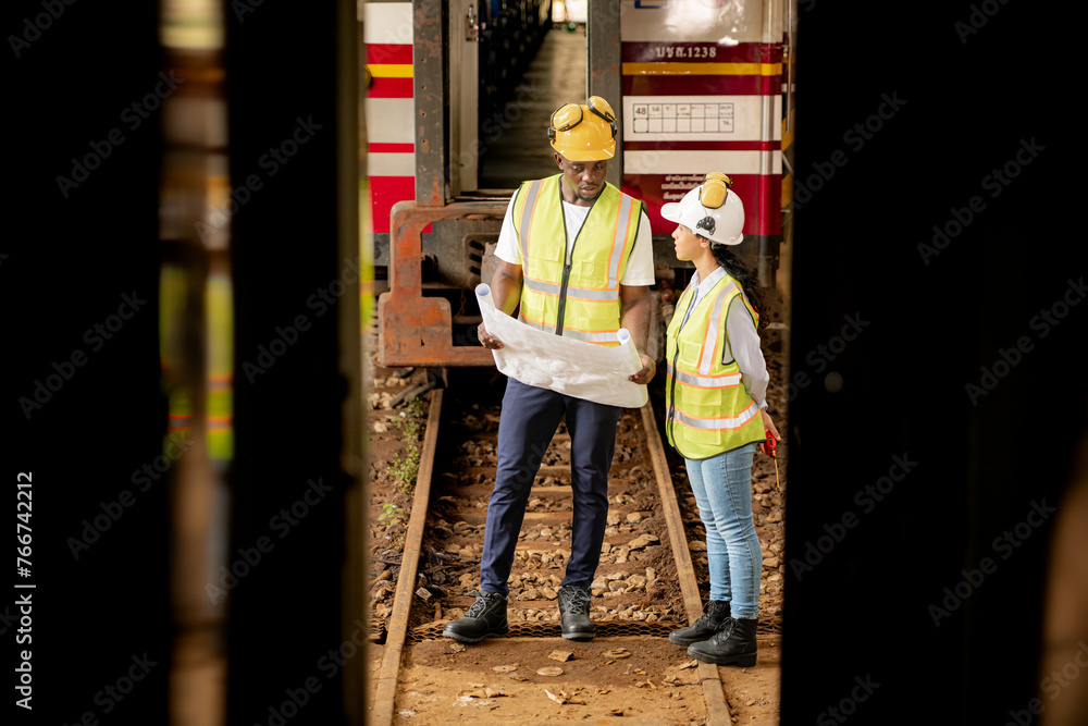 Railway technicians and engineers, Inspect the trains in train repair station before being used to drag train cars to receive or transport goods and people.