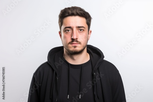 Young man doing surprise gesture on white background. Looking at camera.