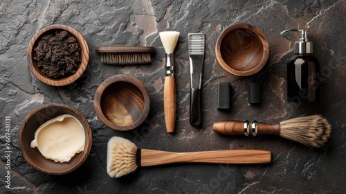 A premium array of wooden shaving accessories and natural grooming products neatly arranged on a textured dark stone surface.