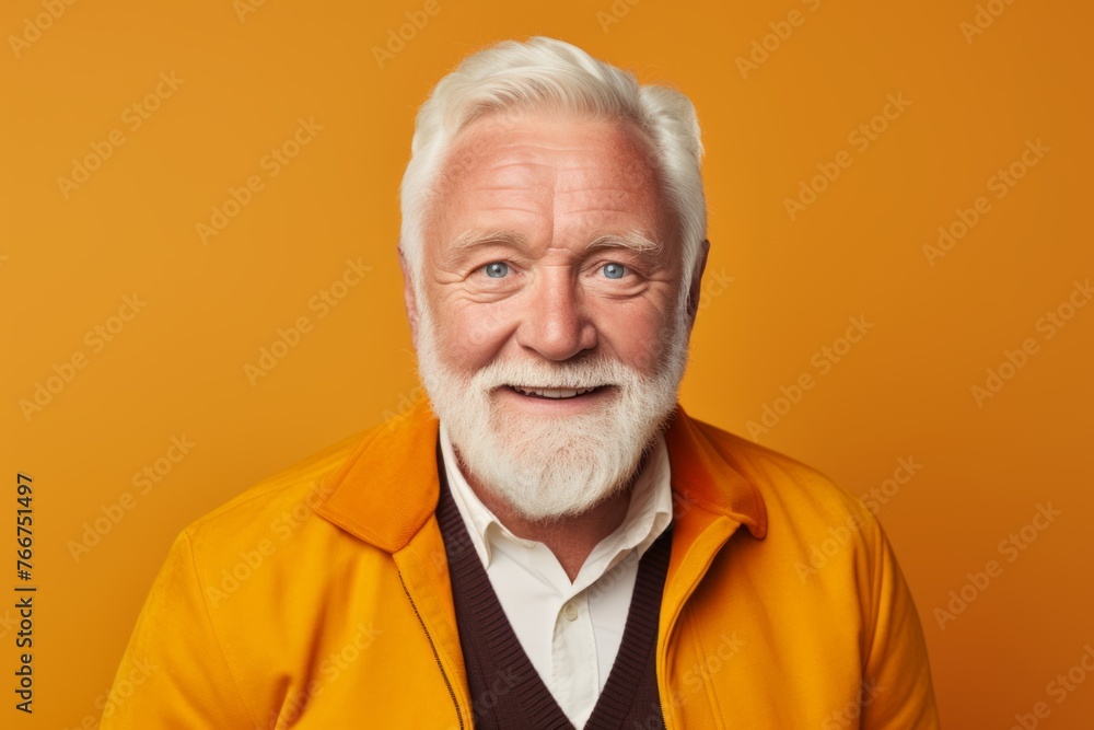 Portrait of senior man with white beard. Isolated on orange background. Portrait of senior man with white beard. Isolated on orange background.