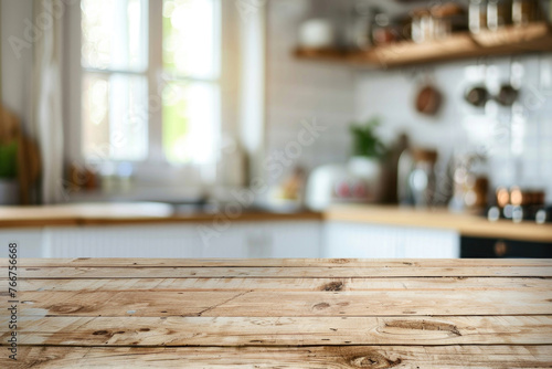 Blurred kitchen background with a focus on the wooden tabletop © Veniamin Kraskov