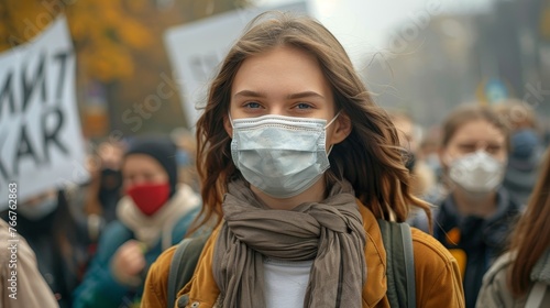 A group of people wearing masks and participating in a protest or demonstration against environmental pollution, holding banners 