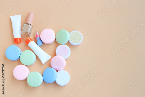 Cosmetic bottle containers isolated on beige background, Beauty products