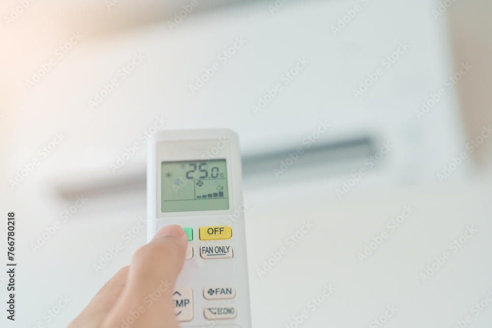 hand operating remote controller for adjust Air conditioner inside the room of office or house hand operating remote controller for adjust Air conditioner inside the room of office or house
