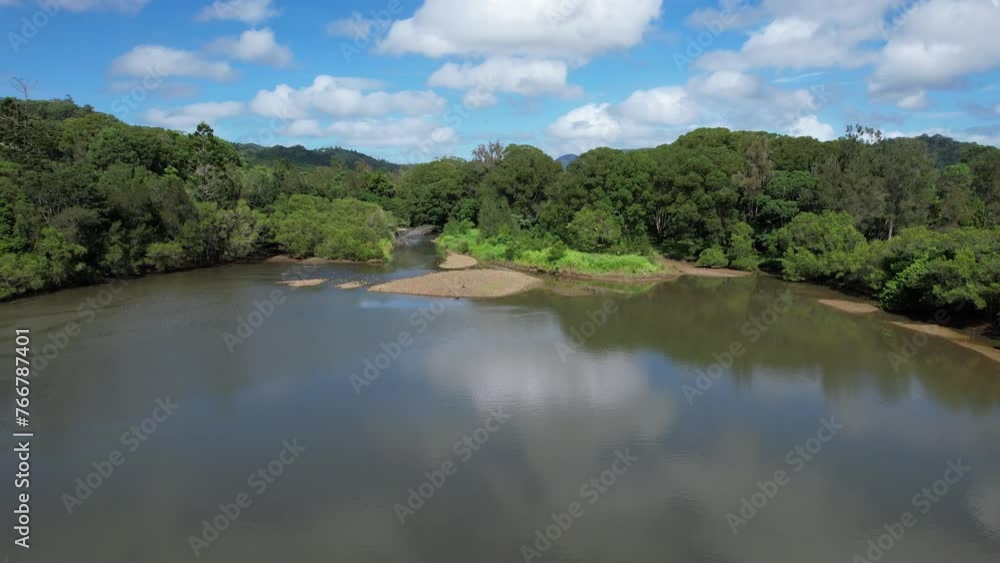 Currumbin Creek With Calm Waters Surrounded By Lush Vegetation In Currumbin Valley, Queensland, Australia. Aerial Pullback Shot Currumbin Creek With Calm Waters Surrounded By Lush Vegetation In Currumbin Valley, Queensland, Australia. Aerial Pullback Shot