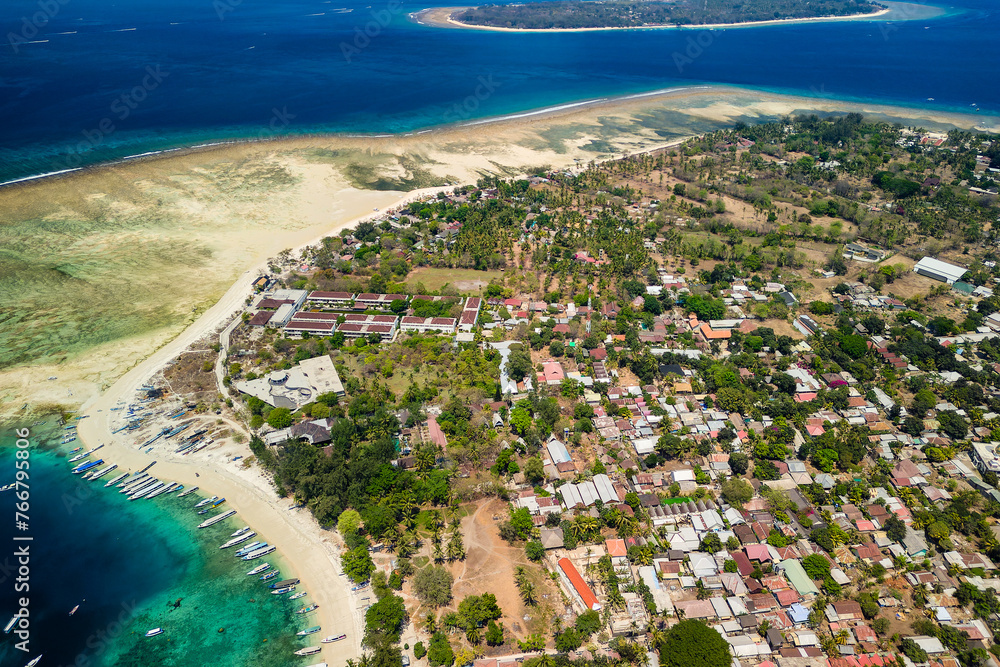 Aerial view of the harbor, port and boats of the tiny tourist island of Gili Air off the island of Lombok