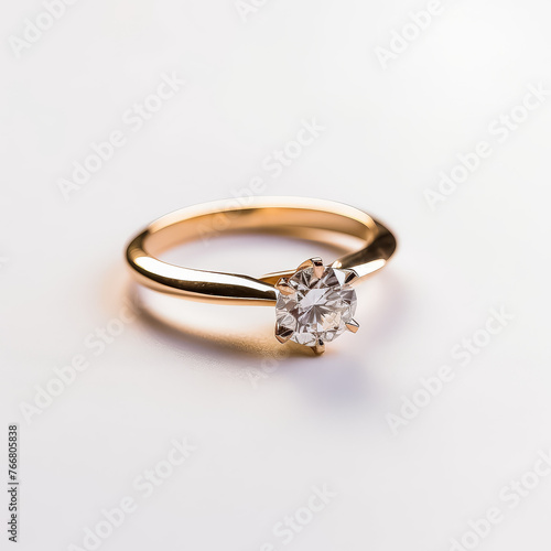 A gold ring with a diamond in the center