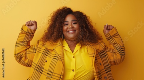 Happy overweight african american woman loves herself and accepts herself, body positivity photo