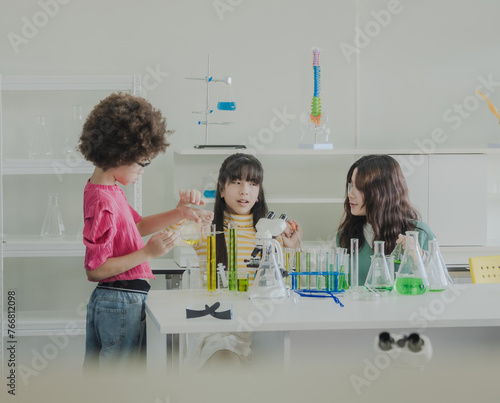 Portrait child kid girl asian young student tree people team group learning and smile have fun happy with science lab technology with in the classroom has a tubetest Microscope chemicals on table photo