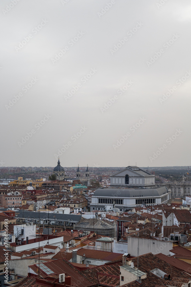 Aerial photography of the city of Madrid with the Royal Theatre, different houses, roofs and rooftops.