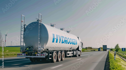 A hydrogen tank truck on the highway with a clear sky in the background. Renewable energy