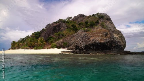 Castaway Qalito Malolo Island Wilson  Tourism Fiji boat ride sailboat Roro Reef coral white sandy shores rocky boulder hillside tropical palm tree paradise Mamanuca group nature landscape stunning photo