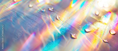 Overlay effect of rainbow light refraction with a blurred texture for photos and mockups. Diagonal holographic flare created by organic drops on a white wall, casting shadows for natural light effects