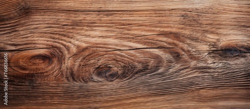 A detailed view of a wooden surface showing multiple knots and intricate grain patterns