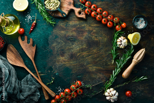 Cooking background. Fresh spices, rosemary and vegetables. Top view. Free space for text.