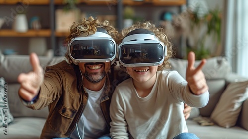 Happy father and son playing video games with virtual reality headset at home