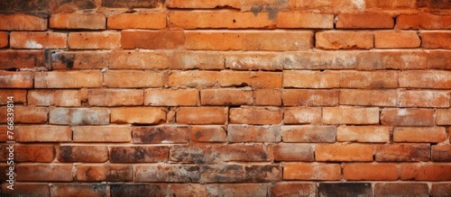 A detailed close up of an old brick wall showing signs of decay with an extensive accumulation of rust spreading across the surface photo