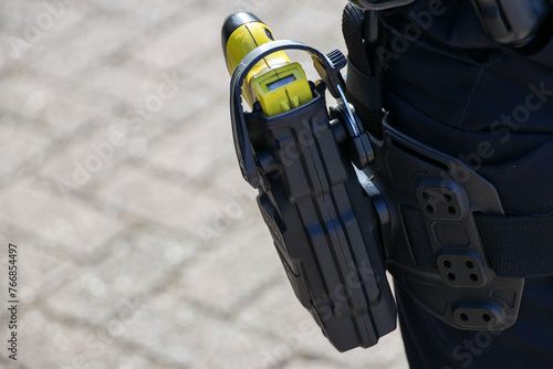 Taser electric shock weapon on a police officer's belt
