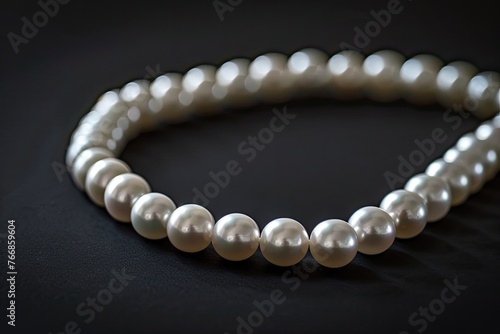 Isolated pearl necklace on black background
