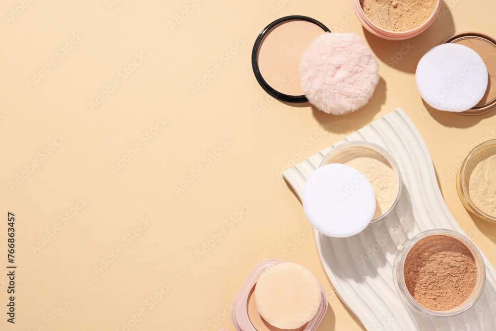 Bottles of face powder, different shades, on a pastel background. Bottles of face powder, different shades, on a pastel background.
