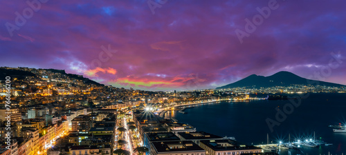Fototapeta Naklejka Na Ścianę i Meble -  beautiful night panorama of Naples city with nice lights streets flashlights and buildings and volcano Vesuvius with amazing sky on background