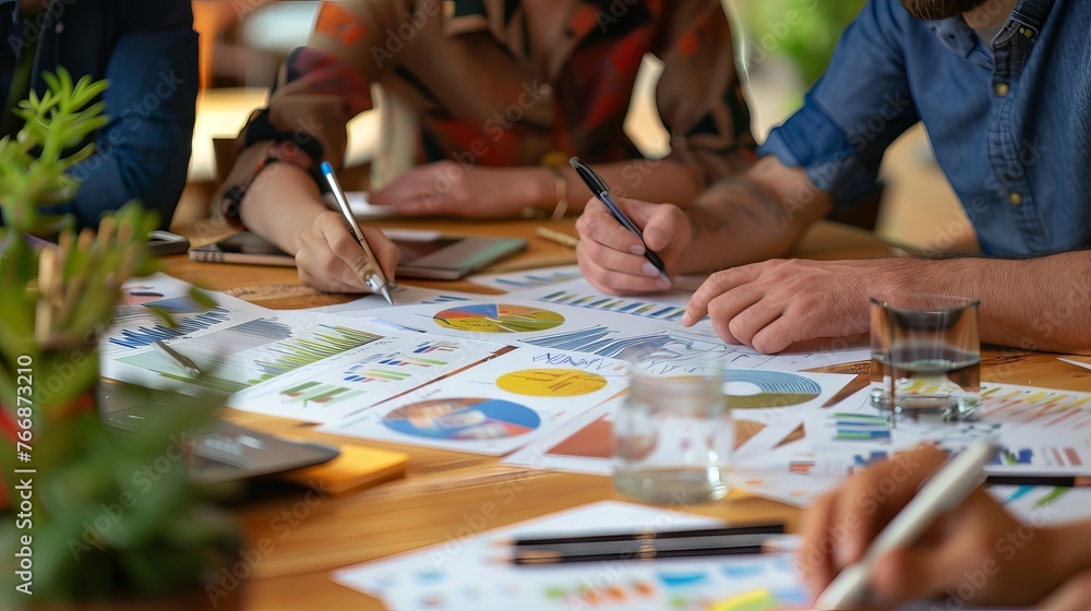 Strategic business team engaged in collaborative planning for financial investment projects Strategic business team engaged in collaborative planning for financial investment projects