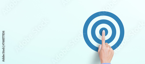 Target concept with Hand of the businessman pressing target icon