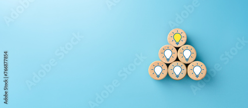 Wooden cubes with light bulb and question marks icons, Innovation and solution concepts, copy space