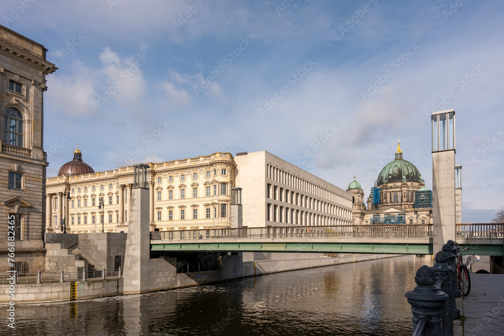 The river flows along the ancient houses of the European city of Berlin. Ancient houses and river in Berlin.