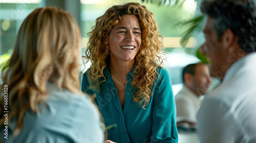 Engaged individuals are in the midst of a lively discussion at a casual meeting. photo