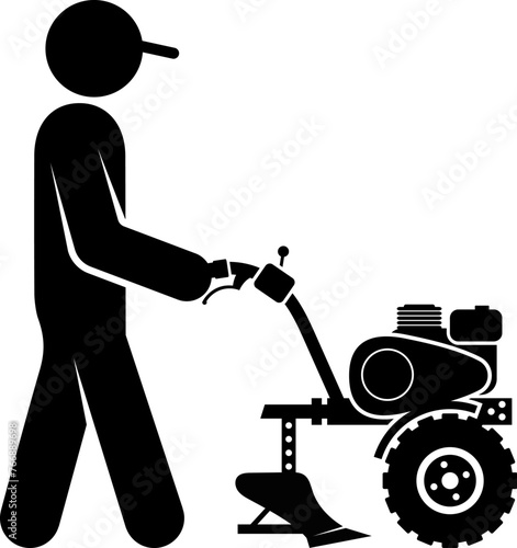 Silhouette of a man with a gasoline walk-behind tractor in his hands