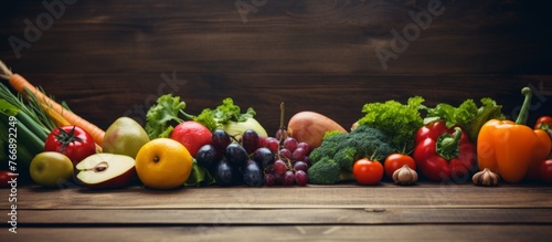 A natural foods display on a rustic wooden table showcasing an assortment of fresh fruits and vegetables, perfect for incorporating into recipes or enjoying as whole food ingredients