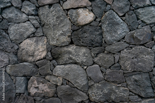 Traditional volcanic rock wall from the Azores, Portugal. Authentic island craftsmanship captured in stunning detail.