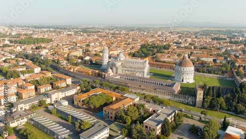 Pisa, Italy. The famous Leaning Tower and Pisa Cathedral in Piazza dei Miracoli. Summer. Evening hours, Aerial View