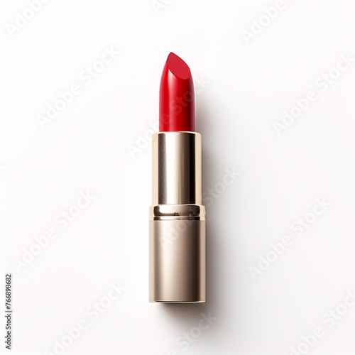 Red lipstick tube on a white surface