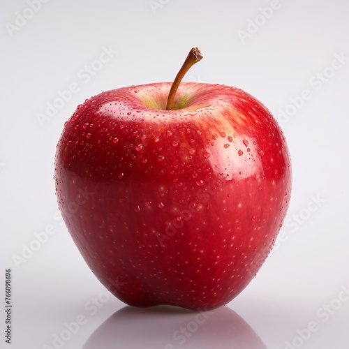 A red apple on a white background with soft lighting