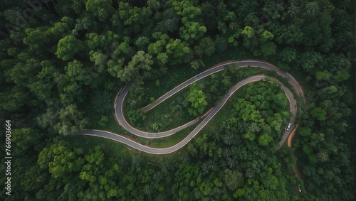 Bird's eye view of a winding road cutting through a lush forest during the rainy season Generative AI