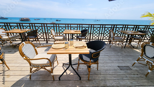 Tables in a restaurant near the beach © sayrhkdsu