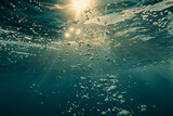 Tranquil Underwater Scene: Bubbling Ocean Surface with Streaming Light, Background