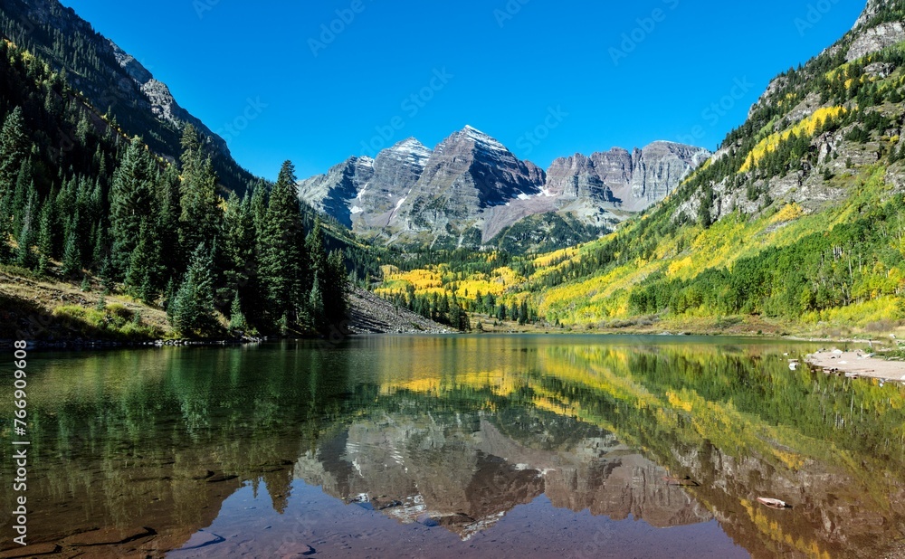 Autumnal view of Rocky Mountain peaks called the Maroon Bells.